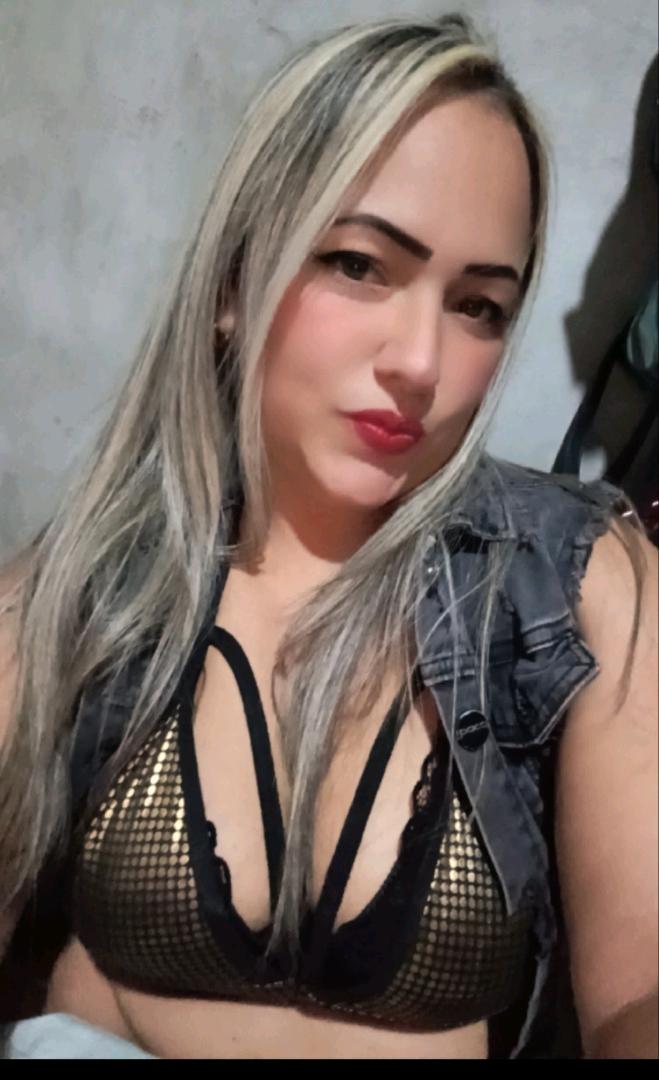 Adult woman glancing at her camera before a new video match