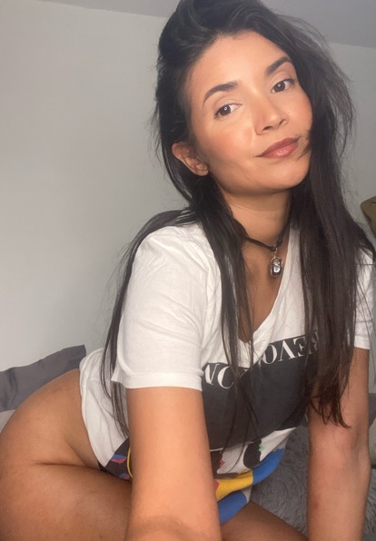 Adult woman glancing at her camera before a new video match